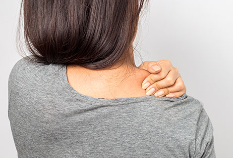Woman suffering with shoulder pain
